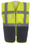 Introducing the Yoko YK002, a high-visibility safety vest in bright yellow with gray reflective stripes. It boasts multiple pockets, a clear ID pocket, and a front zipper, complemented by a black bottom section.