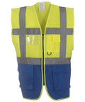 The Yoko YK002 is a bright yellow and blue safety vest featuring reflective gray stripes and multiple front pockets. This sleeveless vest includes a front zipper closure.