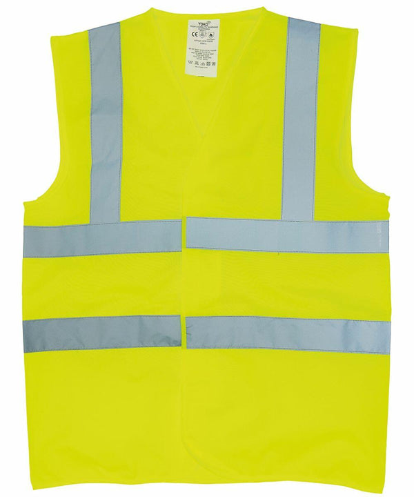 A bright yellow Yoko YK016 high-visibility safety vest with reflective gray stripes horizontally on the chest and around the waist, and vertically over the shoulders.