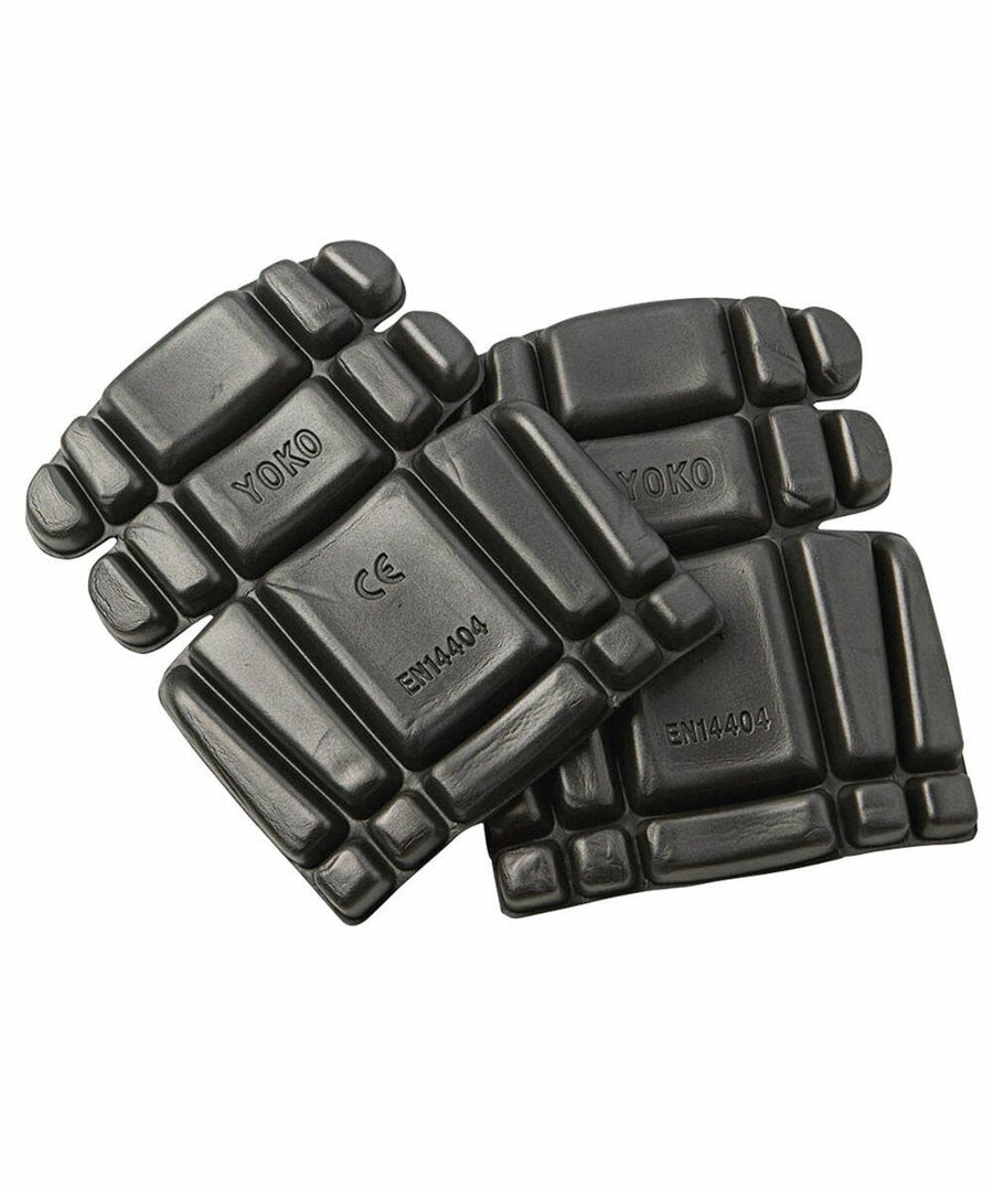 Four black knee pads with padding segments, labeled "YK022 by Yoko" and with certification markings, arranged on a white background.
