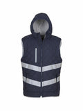 The Yoko YK026 is a dark quilted sleeveless hooded vest featuring reflective stripes, a front zipper, and a zipped chest pocket.