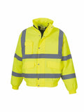 The Yoko YK043 is a vibrant yellow safety jacket featuring reflective gray stripes on the front, back, and arms. It is designed with a high collar, snap-button closure, multiple front pockets, and elastic cuffs.