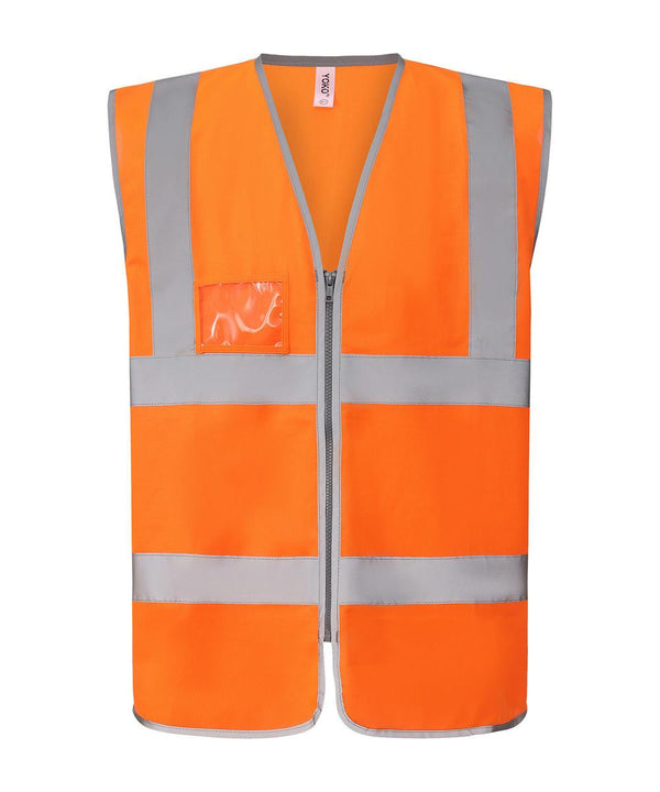 The Yoko Hi-vis zip ID reflective border waistcoat (HVW103) is an orange safety vest with grey reflective stripes, a front zip fastening, and a clear ID pocket on the left chest, shown against a white background.