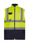 The Yoko YK105 is a high-visibility safety vest made from bright yellow fabric with reflective gray stripes. It features a zippered front, a flap pocket on the chest, and two large pockets at the waist.