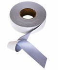 A roll of Yoko YK203 gray adhesive tape with one end unfurled, showcasing a smooth surface.
