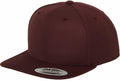 A maroon snapback cap from Flexfit By Yupoong, product name YP001, with a flat brim is shown. It features a label on the brim with the text Snapback and Yupoong. The cap has a classic design with a button on top and visible stitching.