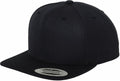 A plain black YP001 snapback cap by Flexfit By Yupoong, featuring a flat brim and a silver sticker on the bill.