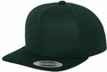 A dark green YP001 snapback cap by Flexfit By Yupoong, featuring a flat brim with a silver sticker on the brim that reads The Classic Snapback, is shown from a front side angle.