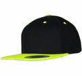 The YP002 by Flexfit By Yupoong features a black cap with a bright yellow visor, matching top button, and eyelets, displayed on a white background.