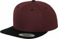 A YP002 snapback hat by Flexfit By Yupoong, featuring a burgundy crown and black visor. The front is plain, with a sticker on the brim that reads Snapback. It also includes ventilation holes on top for added comfort.