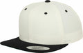 The YP002 from Flexfit By Yupoong is a white snapback cap featuring a black flat brim, a black button on top, and black eyelets, complete with a sticker on the brim.
