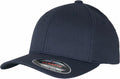 The YP004 from Flexfit By Yupoong is a dark blue baseball cap featuring a curved brim and a FLEXFIT YOUTH sticker on the brim. Displayed at an angle, the cap showcases its straightforward design and structured style.