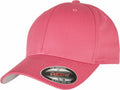 This is the YP004 cap by Flexfit By Yupoong, featuring a pink design with a curved brim and an adjustable back. The front displays a small sticker labeled "FLEXFIT." The cap is presented against a plain white background.