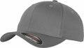 The YP004 by Flexfit By Yupoong is a gray baseball cap featuring a slightly curved brim and a sticker on the underside. It boasts a plain design with a small button on top and six stitched ventilation eyelets for added comfort.