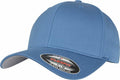 A blue baseball cap featuring a curved brim and a front sticker that displays the brand name Flexfit By Yupoong alongside the size designation L/XL. The cap seems to be crafted from fabric material, consistent with product YP004.