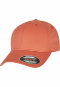A plain orange baseball cap with a curved brim and a front sticker displaying "The Original Flexfit" and "It Fits Your Life," from the Flexfit By Yupoong brand, model YP004.