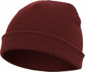 A maroon knit beanie hat with a folded brim, identified as product YP013 from Flexfit By Yupoong, displayed against a plain white background.