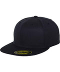 A YP017 cap in plain black featuring a flat brim and a sticker on the brim, crafted by Flexfit By Yupoong.