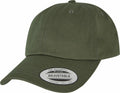 A YP022 by Flexfit By Yupoong is a green adjustable baseball cap with a curved brim and a sticker on the front.