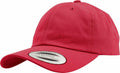 A red baseball cap from Flexfit By Yupoong featuring a curved brim and a CLASSICS sticker on the front, with model number YP022. The cap includes an adjustable strap at the back.