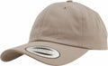 Introducing the Flexfit By Yupoong YP022, a beige baseball cap featuring a curved brim and a round crown. Its authenticity is affirmed by a circular sticker on the brim with the word CLASSICS.