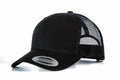 YP023 by Flexfit By Yupoong, a black snapback trucker hat featuring a mesh back and curved brim, displayed at an angle.