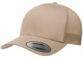 A beige snapback cap featuring a solid front panel and a mesh back, branded as Flexfit By Yupoong with the model name YP023. The sticker on the brim reads "The Classics YUPONG Snapback Since 1974.