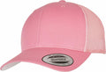 A YP023 snapback hat in pink from Flexfit By Yupoong, featuring a mesh back and curved brim. A sticker on the brim reads "The Authentic Snapback" and "Yupoong Since 1974.