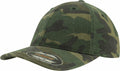 A green camouflage baseball cap with a curved brim, featuring a Flexfit by Yupoong sticker on the front, product name YP026.