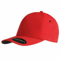 A bright red YP028 baseball cap by Flexfit By Yupoong, featuring a curved brim and a small round sticker on the front that reads FLEXFIT DELTA. The cap boasts a clean, minimalist design with a smooth fabric texture.