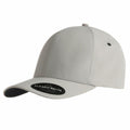 A light gray baseball cap with a curved brim, shown from the side, featuring a sticker on the brim that reads "FLEXFIT DELTA" from the brand Flexfit By Yupoong, product model YP028.