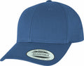 A blue YP035 baseball cap from Flexfit By Yupoong, featuring a curved brim and adjustable strap. The sticker on the brim reads "The Authentic Yupoong Adjustable.