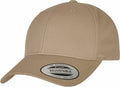 A tan baseball cap featuring a curved brim and an adjustable strap at the back, with a front sticker that reads "The Authentic, Adjustable, Yupoong Since 1974" from the Flexfit By Yupoong brand. The cap is known as product YP035.