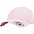 The YP035 by Flexfit By Yupoong is a light pink snapback cap featuring a rounded crown and a curved brim. It has a circular sticker on the brim, signifying it as part of the Yupoong Classics collection. The cap boasts a structured design with visible stitching.