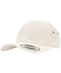 The Flexfit By Yupoong YP036 is a simple beige baseball cap, featuring a curved brim and a sticker on the top side of the brim.