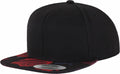 A YP087 snapback hat from Flexfit By Yupoong featuring a black design and a floral-patterned brim.