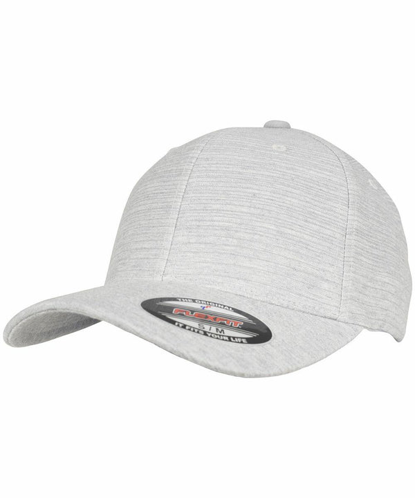 A light gray Flexfit By Yupoong YP107 baseball cap with a curved brim and a sticker on the front indicating its size.