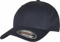 A navy blue YP113 baseball cap by Flexfit By Yupoong, featuring a curved brim with a round sticker displaying the brand name, sizing information, and the slogan "It fits your life." The cap includes vent holes and a button on top.