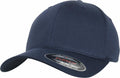 A dark blue baseball cap, model YP113 by Flexfit By Yupoong, with a curved brim and displayed on a white background. A sticker on the brim presents the brand and size details.
