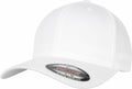 A plain white baseball cap with a curved brim featuring a sticker on the brim that reads "The Original Flexfit S/M." It is the YP113 model by Flexfit By Yupoong, complete with a button on top and visible stitching lines.