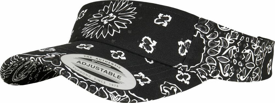 YP143 by Flexfit By Yupoong is a black visor cap adorned with white floral and paisley patterns, featuring an adjustable strap and a label on the brim.