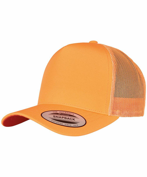 An orange snapback cap with a mesh back and curved bill, featuring a sticker on the front reading "YP163 Flexfit By Yupoong Since 1974.