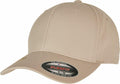 A beige baseball cap with the product name "YP174" from the brand Flexfit By Yupoong, featuring a sticker on the brim reading "FLEXFIT.