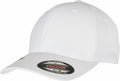 A plain white baseball cap featuring a small round sticker on the brim that reads "The Original Flexfit By Yupoong," model number YP174.