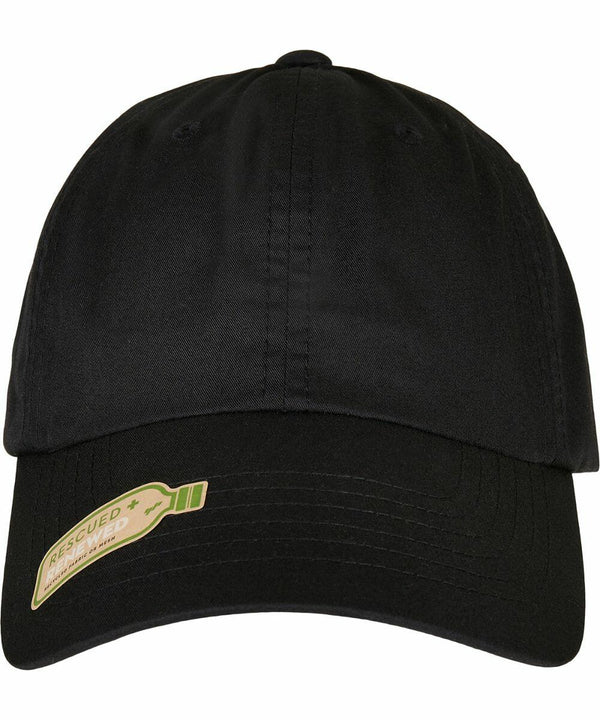A black baseball cap with a sticker that reads "Rescued Paper Waste" featuring an image of a bottle. The cap is the YP175 by Flexfit By Yupoong.