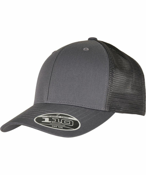 A gray trucker cap with a mesh back and a sticker on the brim displaying "110" and "One Ten." It is the YP185 by Flexfit By Yupoong.