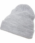 A grey knitted beanie hat with a folded brim, the YP193 from Flexfit By Yupoong.