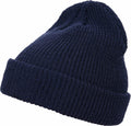 The YP193 by Flexfit By Yupoong is a navy blue knitted beanie with a folded brim, showcased against a white background.