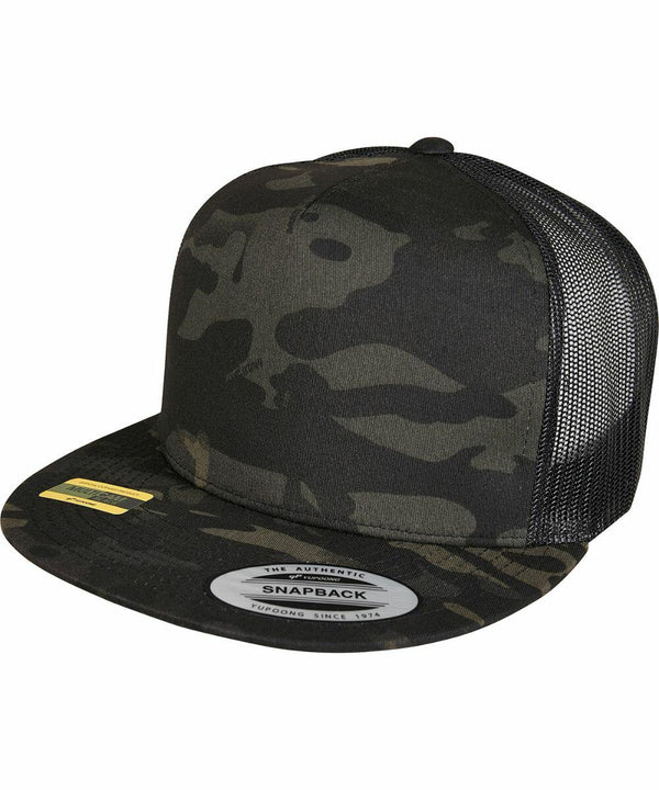 A Flexfit By Yupoong YP210 with a black mesh back and a sticker on the brim.