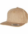 Tan suede snapback cap with a flat brim and a sticker on the front panel, YP216 by Flexfit By Yupoong.